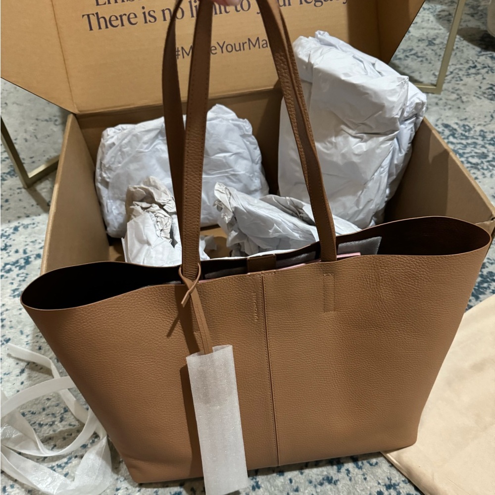 Brand new tote bag with tags.